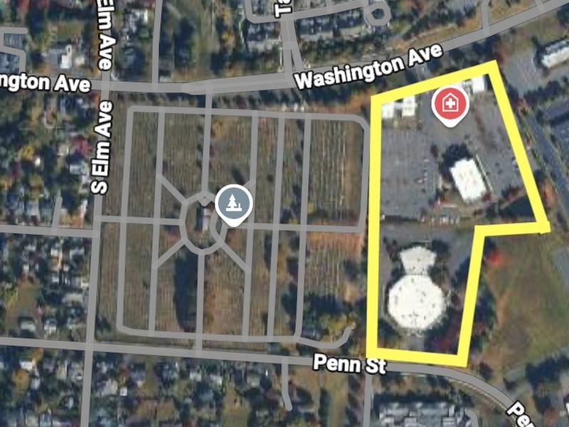 Aerial map of the 661 Penn St site, outlined in yellow, beside Newtown Cemetery